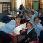 9 year old K is on the right with the blue backpack on her chair