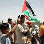Demonstrators in Al Ma'asara called for a stop to the illegal wall which will annex the village's farmland