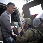 Mohammad Katib from Bi'lin, one of the leaders of the Palestinian popular resistance, arrested when a group of protesters walked towards the entrace of the Halamish settlement during the weekly demonstration in the West Bank village of Nabi Salih, 16.12.2011. Photo by: Oren Ziv/Activestills.org/