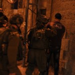 A Palestinian man is arbitrarily detained at Checkpoint 56