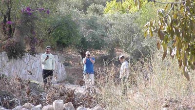 Settlers film and take photos at Khan al-Luban Friday