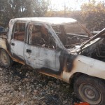 Israeli settlers burn two vehicles and spray paint racist slogans on a Palestinian home in Beit Ummar