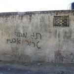 Graffiti in village of Yasouf, reading ‘Price tag; stone terror’, 18 February 2013 (Photo via: Abed Al-Karim a-Saadi/B’Tselem)