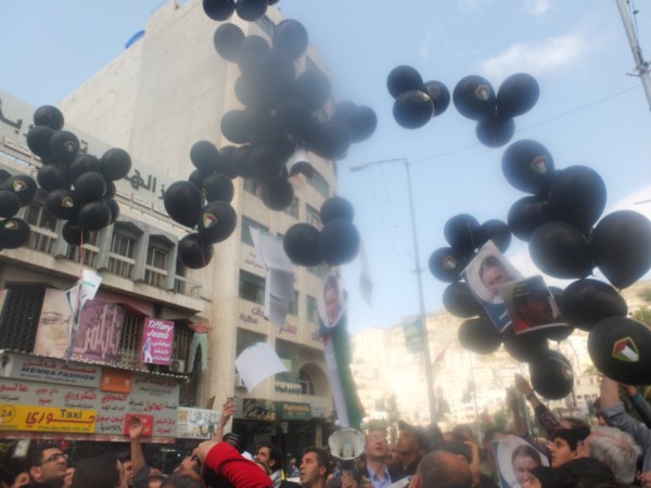 Balloons carrying pictures of Rachel Corrie, Tom Hunrdnall, Vittorio Arrigoni and Arafat Jaradat are released into the sky in Nablus city centre 