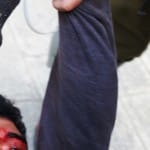 Ibrahim Saadi with wounds to head being dragged down street by soldiers