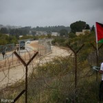 Army arrive as protesters cut down Apartheid Wall. Photo by Hamdi Abu Rahma