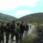 A familiar sight, soldiers and settlers working together. (Photo by ISM)