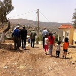 Members of the Hannachi family next to one of the threatened homes