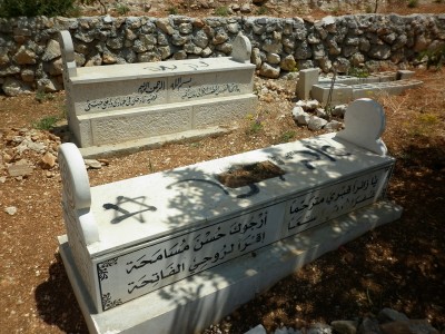 The two graves spraypainted, including a Star of David, a Jewish symbol co-opted by the Zionist movement