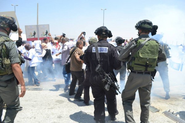 Israeli forces throwing sound bombs at journalists (Photo by ISM)