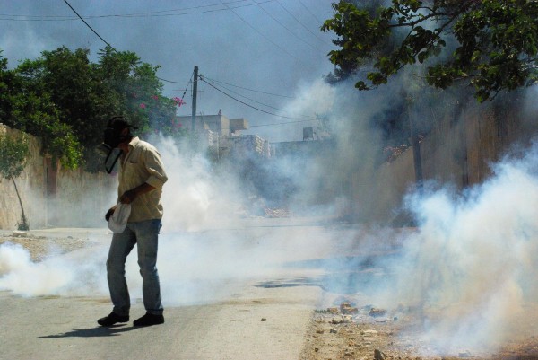 Teargas filling the streets of Kafr Qaddum village (photo by Sevenson Berger)