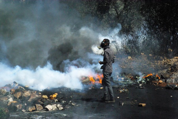 Protester on blocked road leading to Nablus (photo by Svenson Berger)