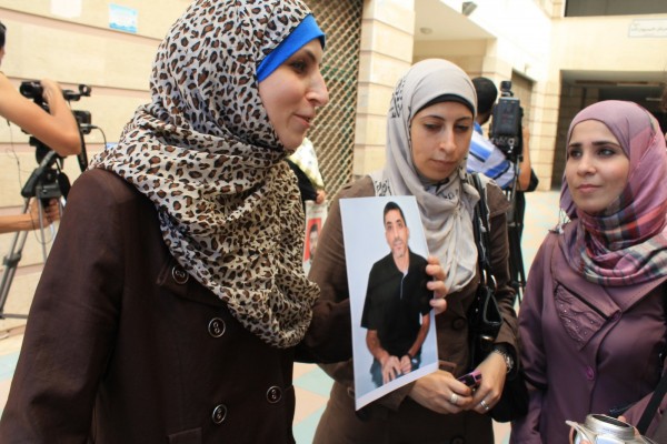 Veronika Abu Sisi, left, speaks with supporters. (Photo by Joe Catron)