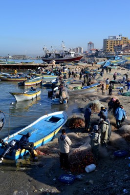 Fisherman and their boats in the Gaza seaport. (Photo by Rosa Schiano)