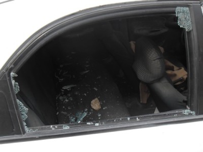 A broken car window, the result of illegal settlers throwing stones (photo by ISM).