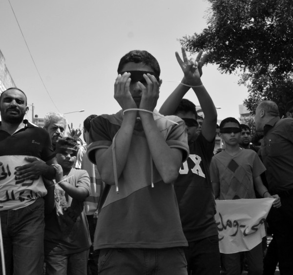 Many children participated in the march, handcuffed and blindfolded to symbolize the brutality of Israeli authorities. (Photo by ISM)