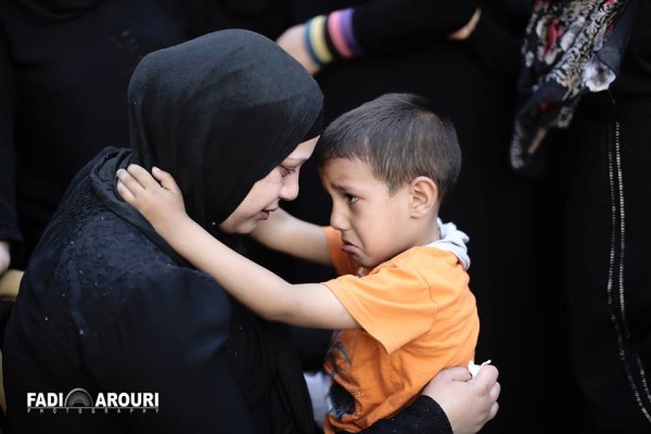 Mahmoud's wife and son (photo by Fadi Arouri).