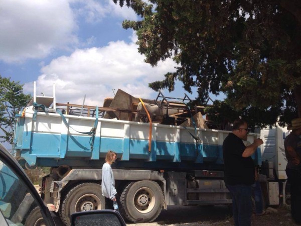 Confiscated belongings loaded into an Israeli truck. (Photo by witness)