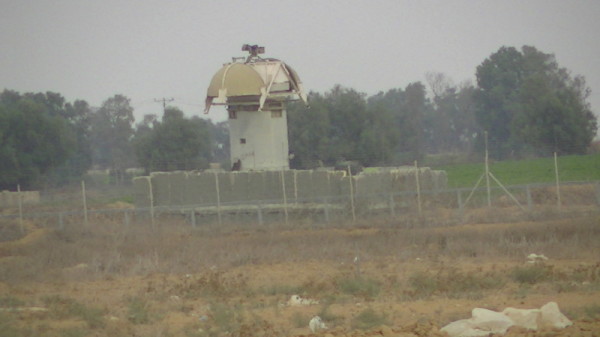 Surveillance tower in the buffer zone in Khuza’a, occupied Gaza Strip. Photo by Corporate Watch, November 2013