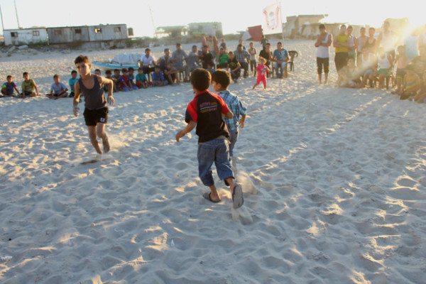 Young relatives of four children killed by Israeli shelling while playing football on a beach in July play their game that was violently cut short, 7 September (Joe Catron)