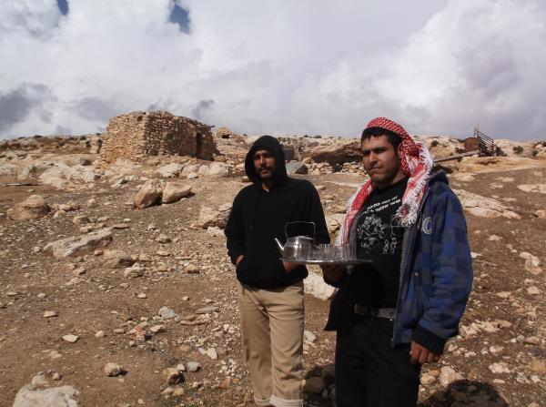 Sofian Maher and local resident near their destroyed home near Khirbet Al-Tawil