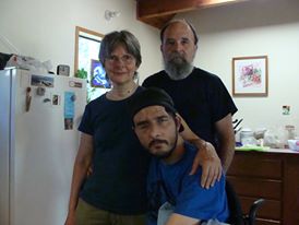 Tristan with his parents, Mike and Nancy Anderson in their home in Grass Valley, California.