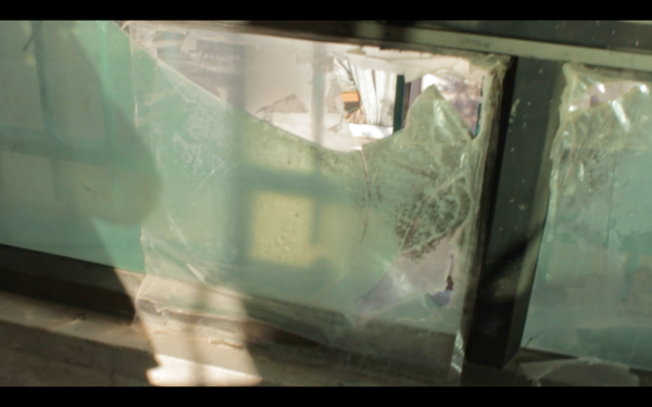 Window broken during Israeli army nigh raid (photo by ISM).