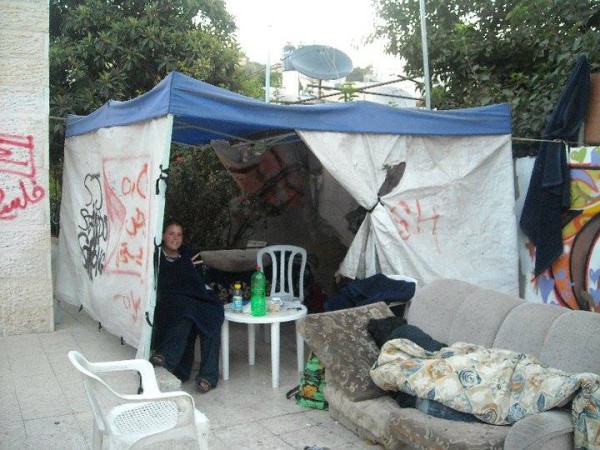 Kayla sitting in a protest tent in Sheikh Jarrah - Photo by 