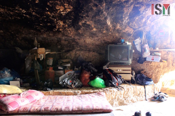 TV inside the cave. Electricity is powered by their wind turbine.  