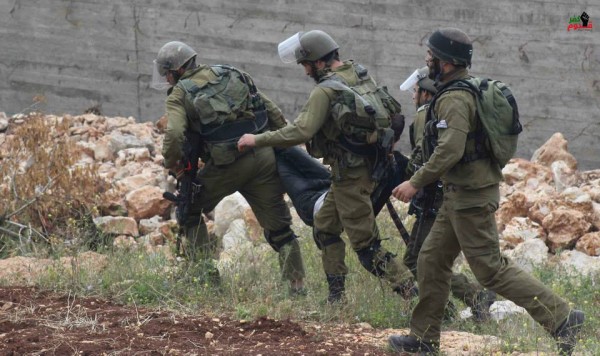Israeli forces arresting an unconscious man 