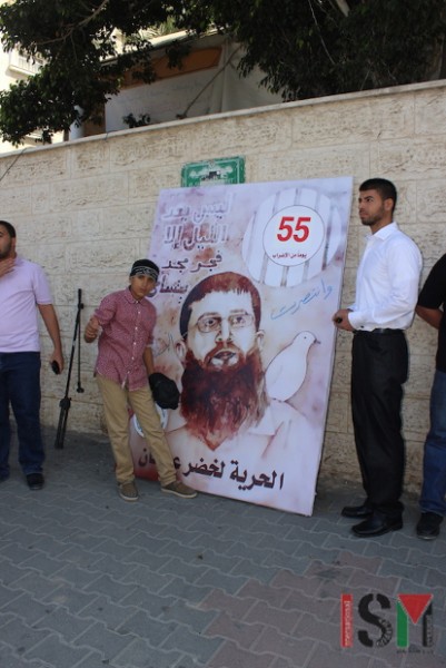 A mural of Khader Adnan with the number 55, the number of days he was on hunger strike this time.