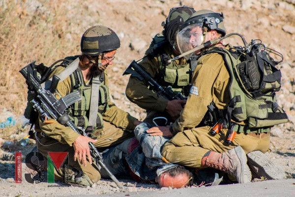 Soldiers crushing a Palestinians head