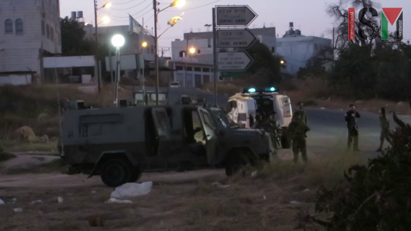 Israeli forces protecting settlers trespassing on private Palestinian land