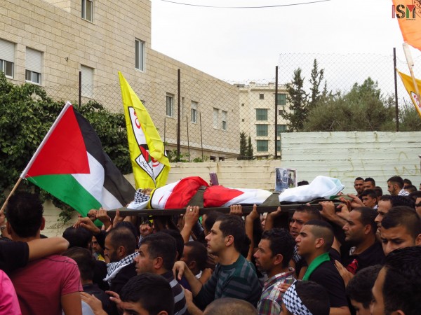 The body of Abed al-Rahman Obeidallah at the funeral march