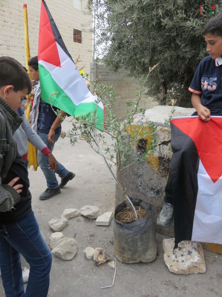 Abed al-Rahman Obeidallahs classmates mourning at the place where Israeli forces shot him