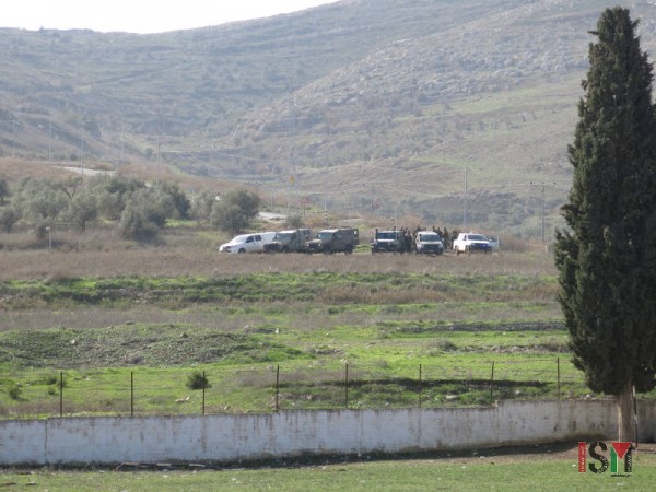 Israeli forces observing the school after the attack.