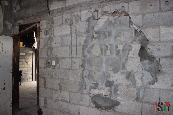 A wall of the family's home, repaired after the bombing