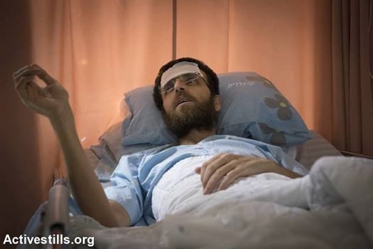 33 year old jopurnalist, Mohammed al-Qeeq, in his hospital bed is today near death.