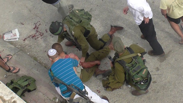 Israeli forces treat the wounded soldier