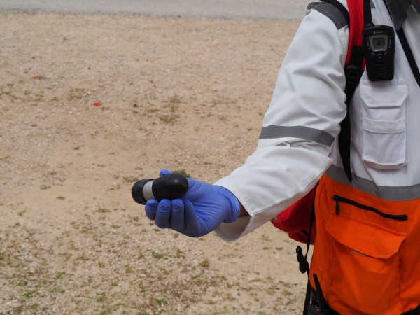 A red crescent medic shows the lethal tear gas canisters that are being used