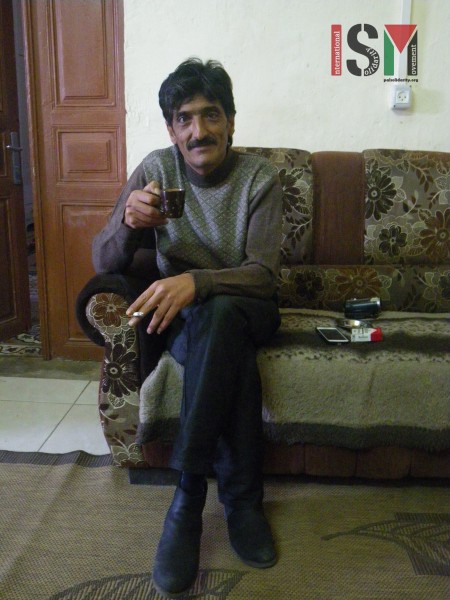 Emad in his family home