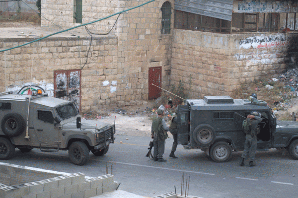 Military jeeps inside the village