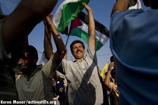 Adeeb Abu Rahma at a demonstration in Bil'in. Abu Rahma has been imprisoned for nearly one year on charges of "incitement" for organizing nonviolent demonstrations. Credit: Activestills