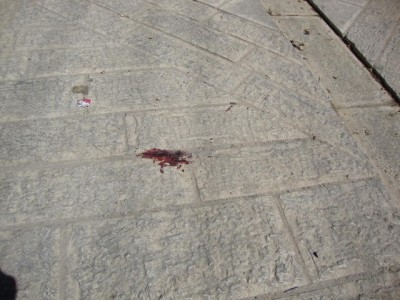 Blood left after a Palestinian boy was attacked by Israeli settlers