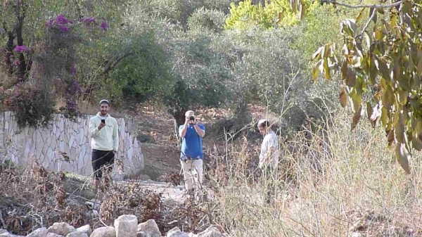 Settlers film and take photos at Khan al-Luban Friday