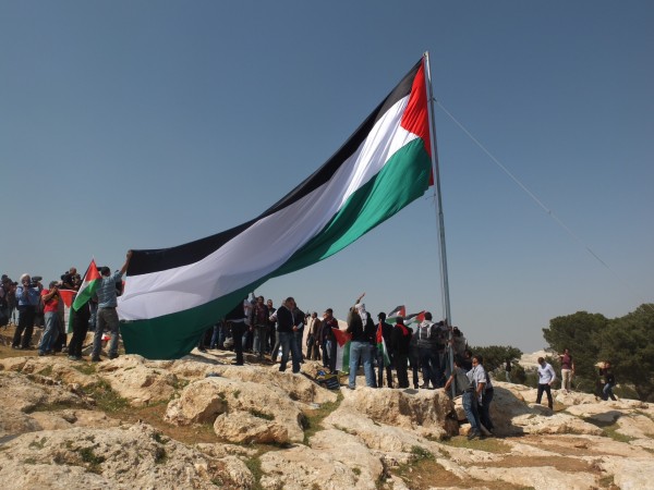 Huge Palestinian flag is erected directly across from Maale Adumim settlement 