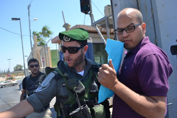 Israeli soldier violently pushes back peaceful demonstrators