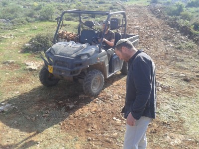 Two of the settlers whom made the attack and the outdoor utility vehicle used to kill the sheep (Aqraba Municipality, March 2013)