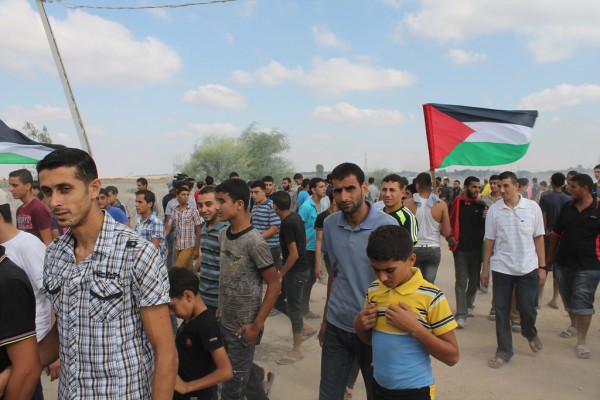 Demonstrators walk away from the separation barrier after the protest. (Photo by Joe Catron)