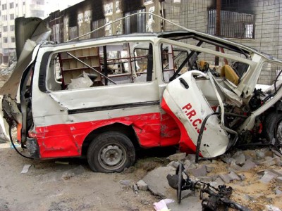 Destroyed Red Crescent ambulance outside the bombed Red Crescent storage and administrative buildings in Tel el Howa, near al Quds hospital.